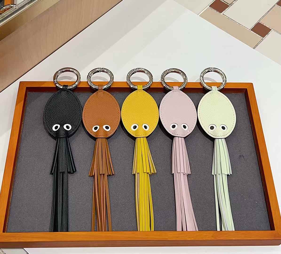 Luxury handcrafted，Cute keychains and backpack charms made.,of genuine leather 钥匙、背包手工真皮挂件