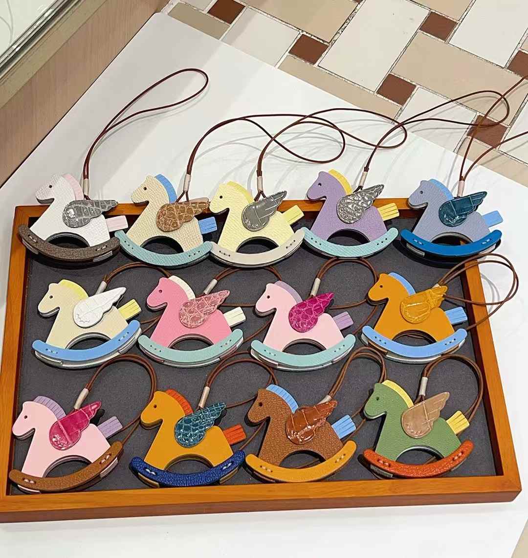 Luxury handcrafted .Cute keychains and backpack charms made of genuine leather 钥匙、背包手工真皮挂件