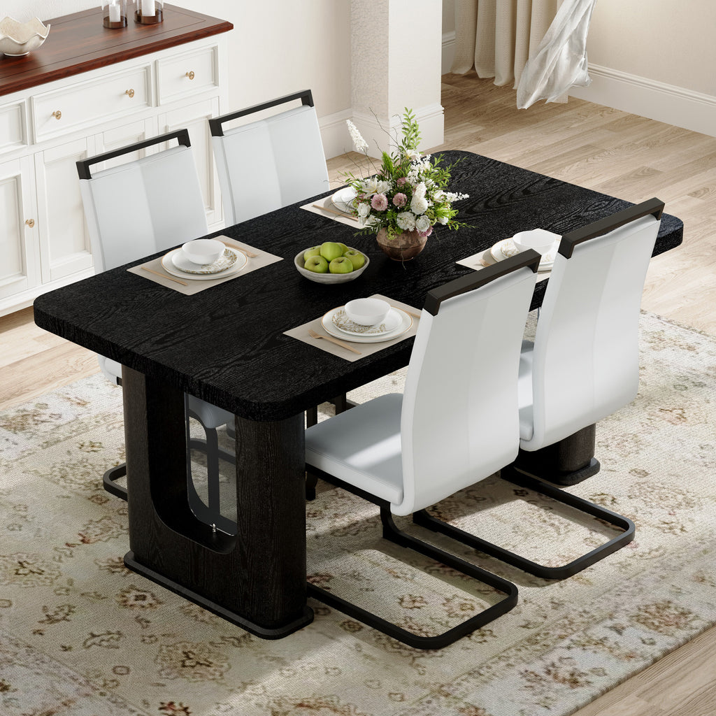 Table and chair set.64.5 x 35.4 Inch Stylish Black Wood Color Textured Dining Table.Paired with 4 White PU chairs with Black Featuring arched black legs.Exudes A Strong Sense Of Fashion.